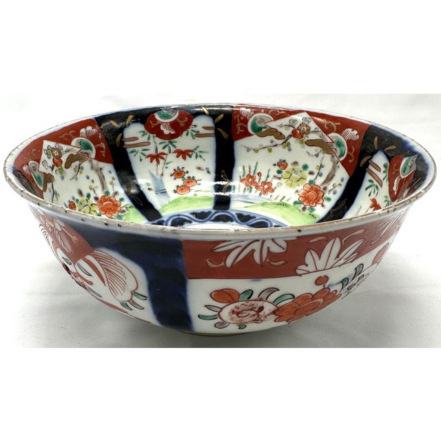Large 19th C. Japanese Imari Scalloped Bowl - Meiji Kinrande Porcelain This substantial antique bowl showcases a complex,...