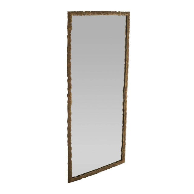 Our supersized floor mirror of antique brass-plated aluminum has a freeform texture reminiscent of twisting vines....