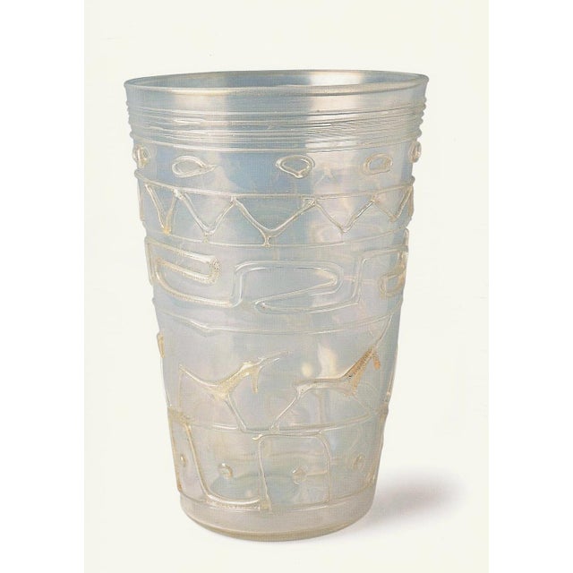 Iridescent vase decorated with applied filaments. Gold leaf inclusions. Graeco-Roman figures and decoration. Signed on the...