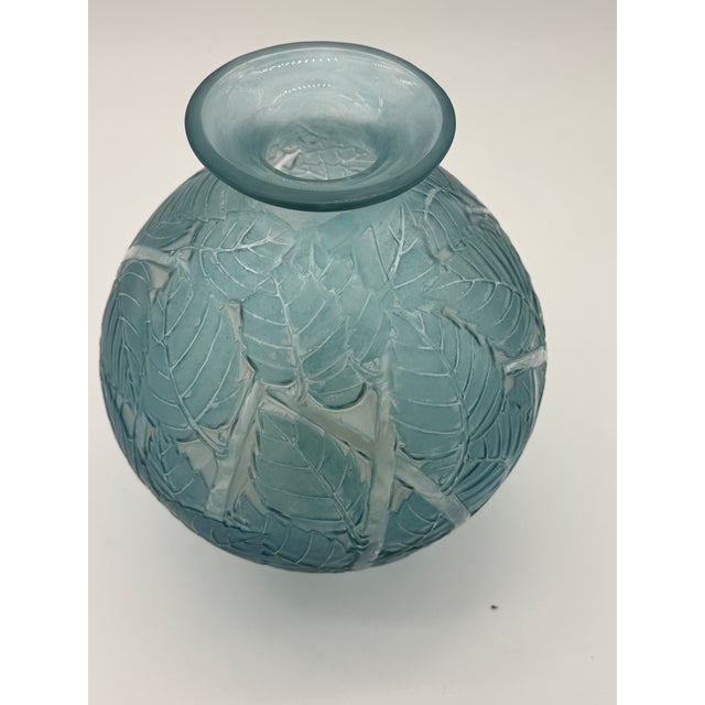 The Milan vase was created by R.Lalique in 1929 in white glass. This example is in excellent condition and in blue...