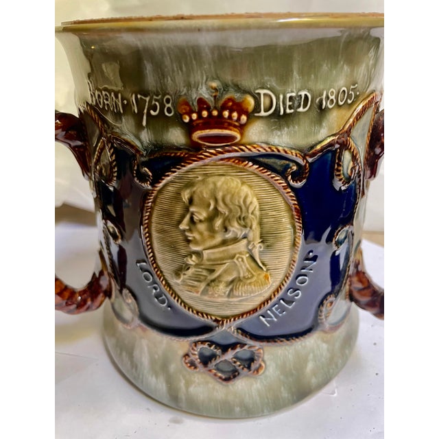 This is a fine quality and wonderfully decorative large loving cup made by Royal Doulton to commemorate the memory of Lord...