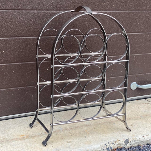 Vintage midcentury chrome wine rack circa 1960s-70s Measures 18.25” high, 13.75” wide and 7.25” deep, holds 9 bottles of...