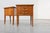 An elegant and uncommon pair of French mid-century bedside tables dating from the 1950s, distinguished by their...