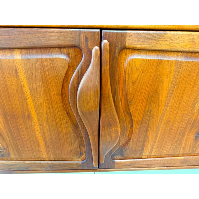 A stunning craft bench made studio piece likely from the 1970’s fashioned out of walnut. It is a floating cabinet with no...