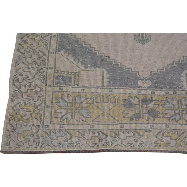 Hand-knotted with care using traditional rug-making techniques, this wool rug blends timeless craftsmanship with a modern...