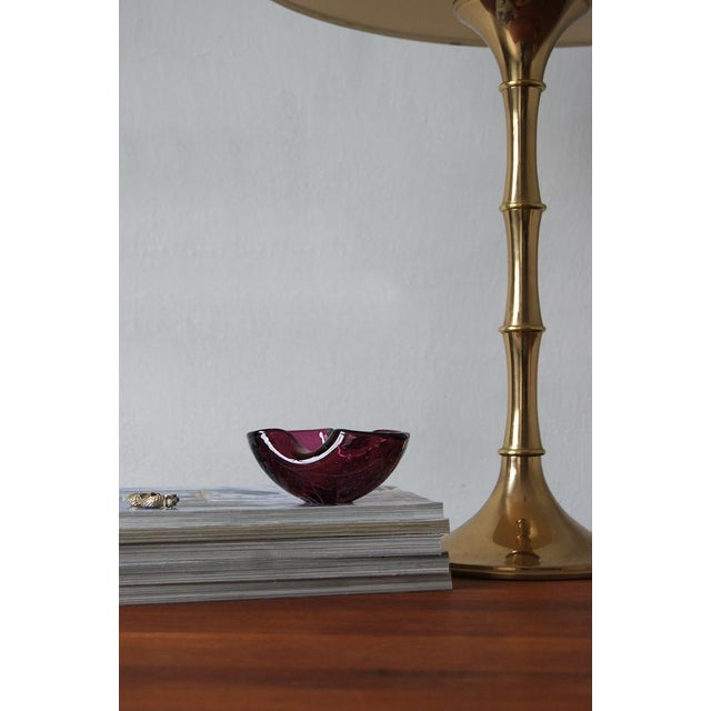 Bowl made of high quality glass. Colored in a traditional metallurgical technique The whole piece is characterized by the...