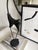 This Mid 20th century piece was influenced from the Art Deco and Mid-century Era's. The black metal finish and the...