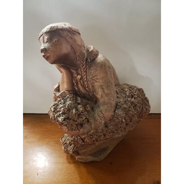 This is a Mid 20th Century Native American Girl Gilded Chalkware & Concrete Sculpture. It measures 17 1/2" high, 10" wide...
