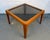 A classic Mid-Century Modern square coffee table (circa 1960s), frequently attributed to Jens Risom. This piece features a...