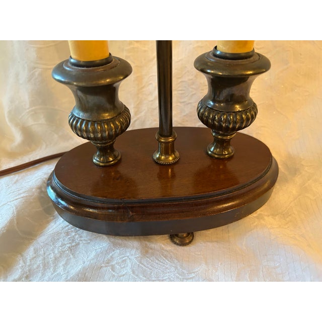 Vintage Empire-style double candlestick Bouillotte lamp with walnut base. The top is capped with a decorative neoclassical...