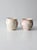 A pair of vintage studio pottery mugs, hand-crafted with a soft cream and pink glaze. Each mug features a hand-painted...