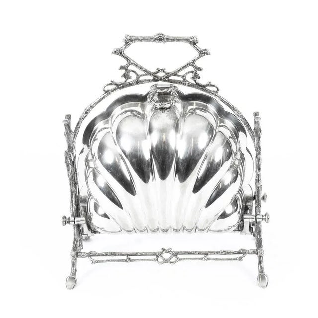 This is a beautiful antique Victorian silver plated folding biscuit box, the base bearing the maker's mark of the renowned...