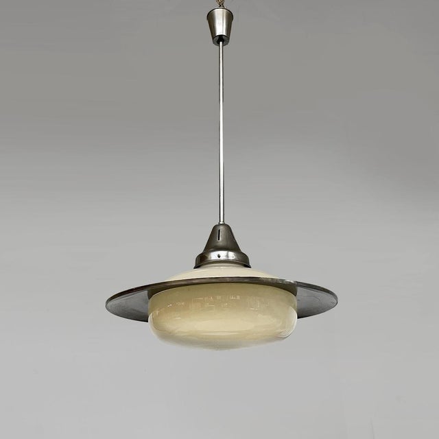 Italian Art deco round chandelier in opaline glass and metal, 1930s Chandelier with round opaline glass diffuser. The...