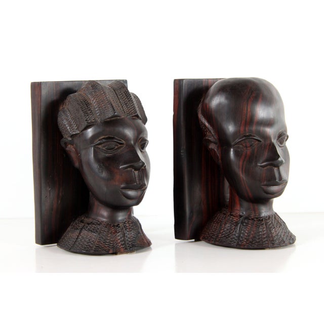 Stunning pair of super heavy and beautifully hand carved solid wenge bookends, depicting a tribal man and woman! These...