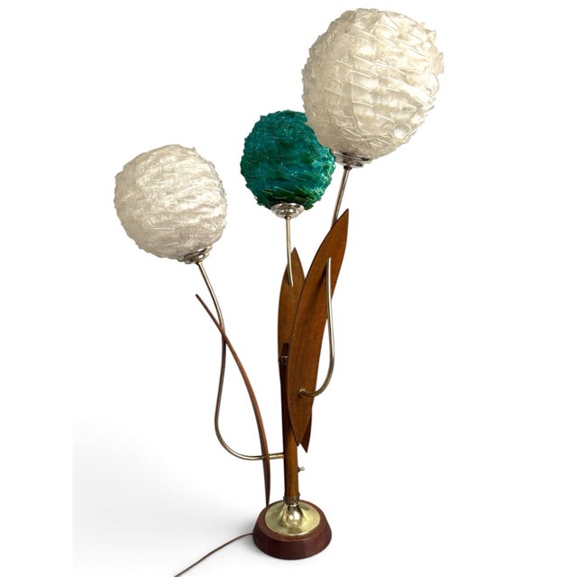 Exceptional Mid-Century Modern sculptural table lamp featuring three original spun acrylic “spaghetti” globe shades in...