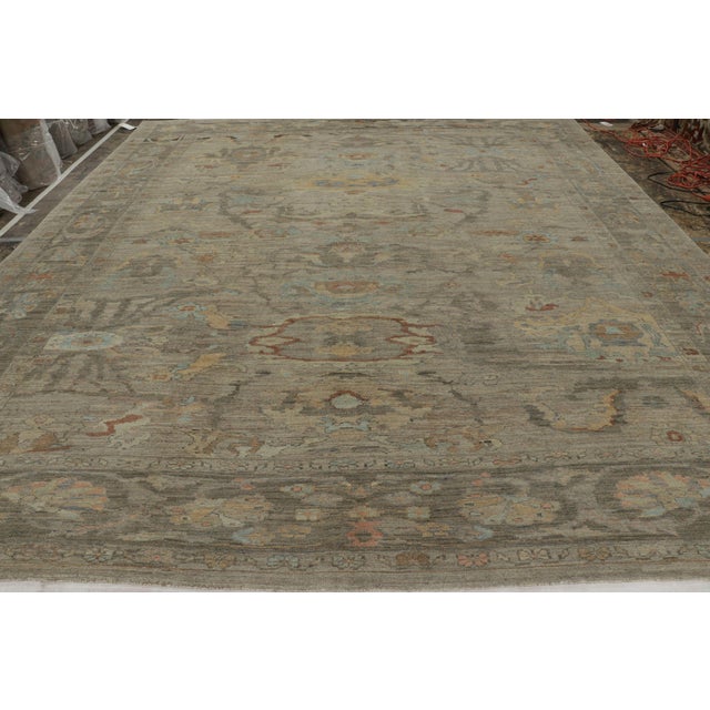 Made with hand-knotted wool, this oversized 13x15 rug is a contemporary reimagining of celebrated vintage and antique...