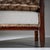 Pair of Art Deco armchairs featuring high backs and prominent armrests. The front legs merge seamlessly into ribbed...