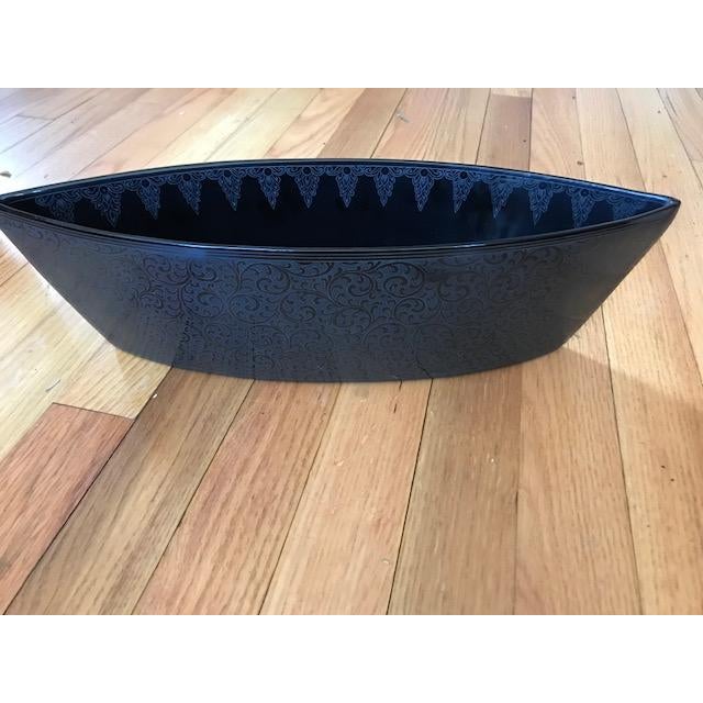 Intricate interior and exterior tone-on-tone etched design complements the distinctive eye shape, distinguishing a bowl...