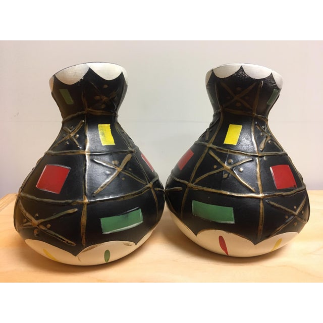 A pair of small mid century abstract vases by Brentleigh Ware. Features black body with raised, textured white, gold, red,...