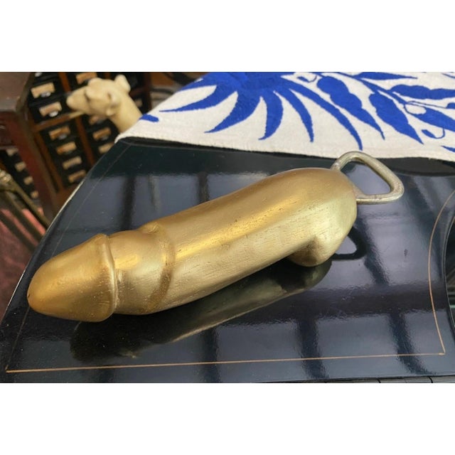 Up for consideration is a beautiful vintage wooden gold painted penis bottle opener. This would look lovely in your home,...