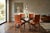 A stunning set of 4 designer chairs, featuring elegant lines and high-quality materials. The chairs feature a sturdy iron...