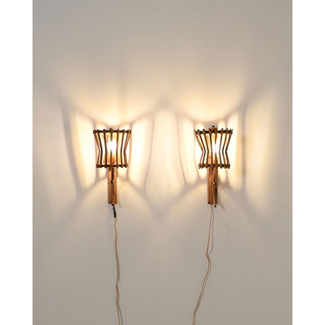Bent bamboo and woven rattan structure with an open cylindrical lampshade. European production, 1950s. A pair of bamboo...