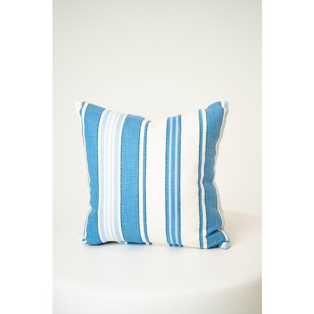 Breezy and cheerful, this 16-inch square throw pillow features classic baby blue and white stripes. The coastal-inspired...