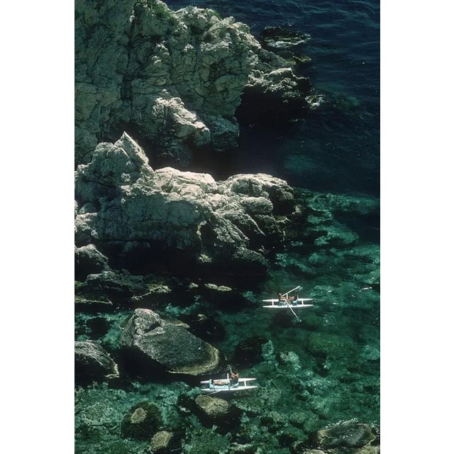 Rowing Off Sicily 1975 by Slim Aarons Slim Aarons Limited Estate Edition Two couples out rowing off the coast of Sicily...