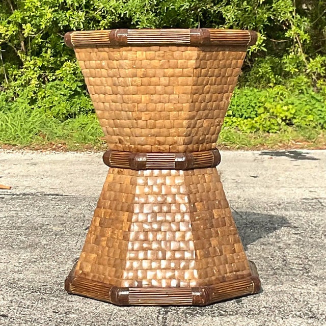 Infuse your space with eclectic charm using this vintage table pedestal crafted from tessellated coconut shell. Its...