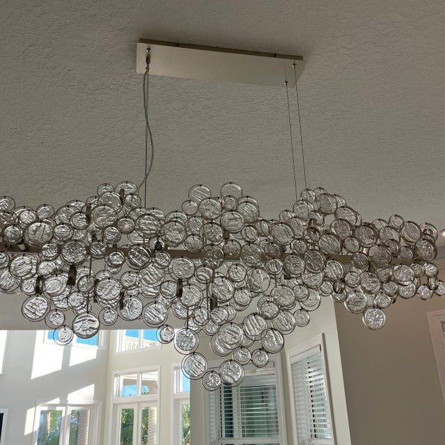 Cast romantic shadows throughout a chic entryway with the intricate details on this fifteen-light oval chandelier from...