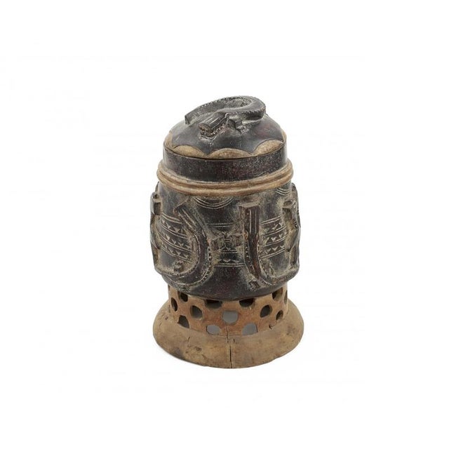 Prestigious wooden vessel, with lid and body resting on an open, perforated base. Typology compatible with Bamileke/Bamum...