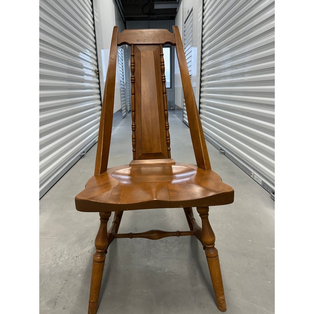 A beautifully handcrafted set of four solid maple dining chairs, blending rustic charm with streamlined mid-century...
