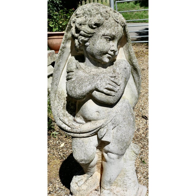 Large Old Weathered Statue of a Cherub or Putti Set on a Plinth. This is a beautifully weathered piece in good detail to...
