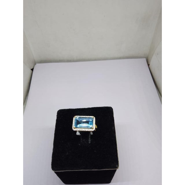 Gemstone details Gold Purity: 18K Solid Gold Blue topaz: 5.70 cts Diamond: 0.20 cts 18K gold Gross weight: 4.53 grams Net...