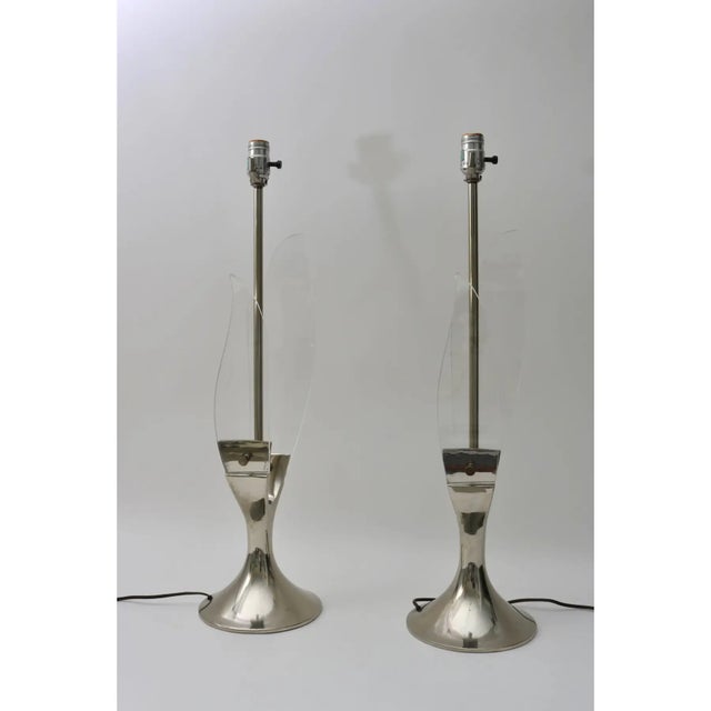 Pair of late Mid-Century Modern Lucite and polished chrome table lamps were designed and produced the American light...