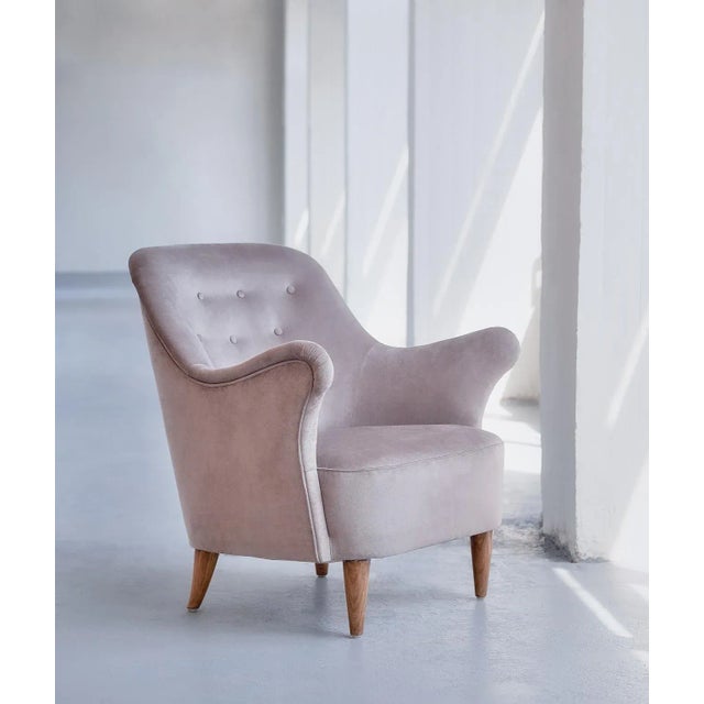 This rare armchair was produced by ab elsa gullberg in the late 1930s. The organically shaped arms of the chair and the...