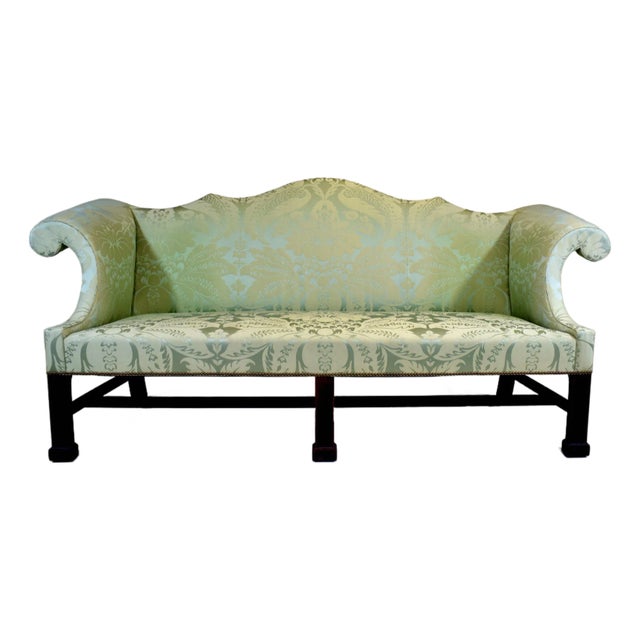 A spectacular Custom George III Mahogany Camel Back Sofa upholstered in exquisite Damask silk accentuating the well drawn...