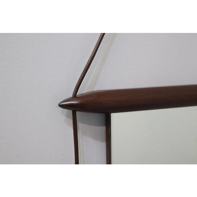 Wall mirrors produced by Mobili Italiani Moderni (MIM). The mirror frame is made of wood and Wood Ribbon. The back of the...