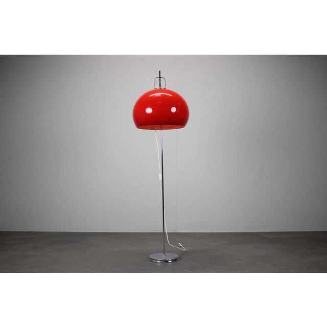 Iconic space age floor lamp designed by guzzini and produced by meblo, made in italy circa 1970. This vintage lamp...