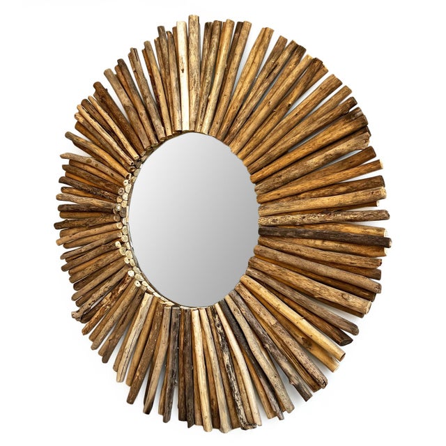 Vintage round sun shape mirror made from layered pieces of driftwood. Each unique with natural wood forms and coloring....