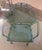 One vintage Metal Garden Chair in green with curved back and floral accents. This individual chair was part of an outdoor...