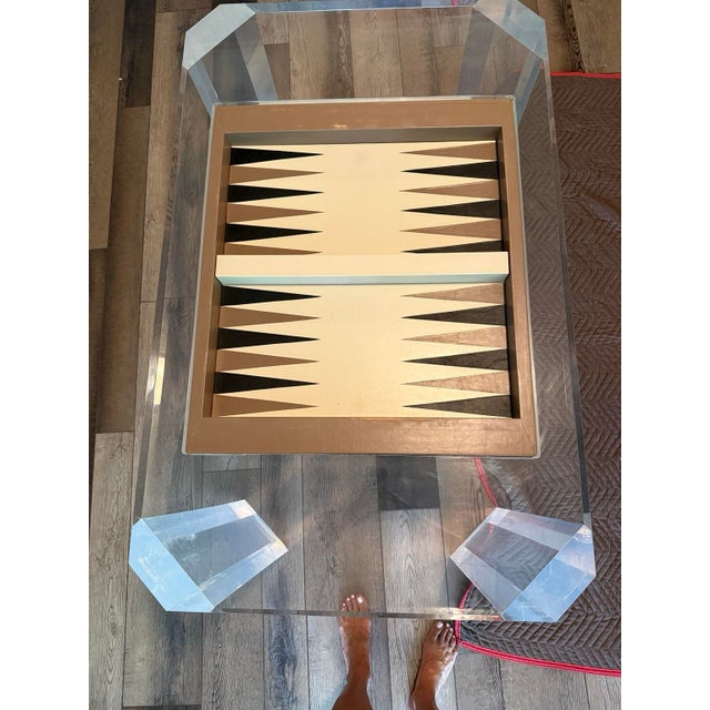 Exceptional vintage Lucite backgammon game table featuring substantial clear acrylic construction, dramatic faceted and...