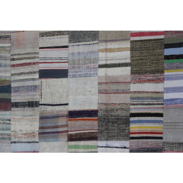 A beautiful Vintage Patchwork Rug. It's in very good condition, practically new. This Patchworks rug is produced of older...