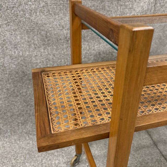 This stylish vintage side table/bar cart features a classic three-tier design, in the manner of Julius Jirasek for...