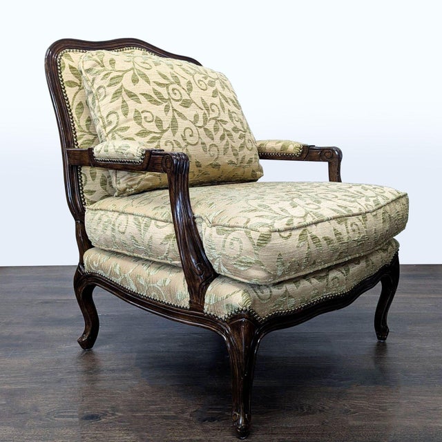 Elegant Louis XV-style bergère lounge chair featuring a carved hardwood frame with a rich walnut finish, graceful cabriole...