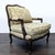 Elegant Louis XV-style bergère lounge chair featuring a carved hardwood frame with a rich walnut finish, graceful cabriole...
