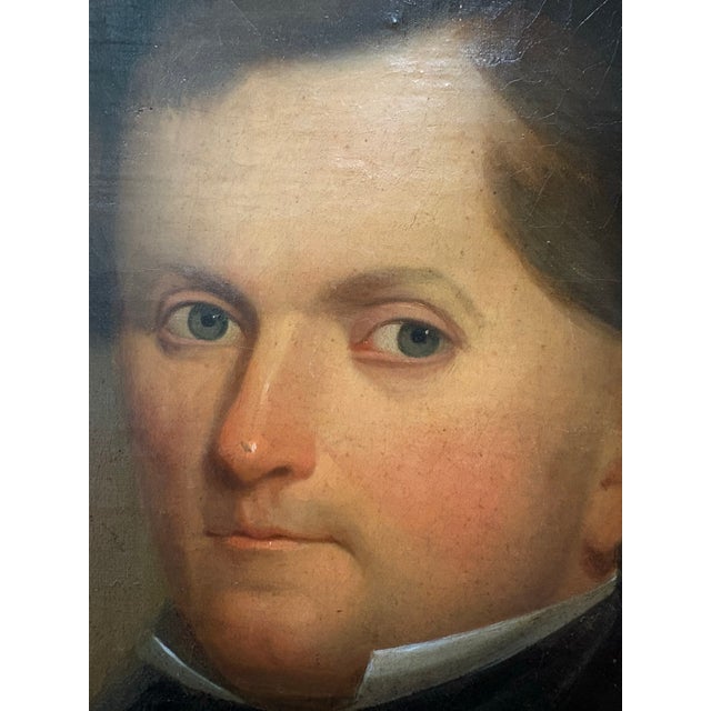 A compelling 19th‑century oil portrait on canvas, depicting a distinguished gentleman seated in formal Victorian attire...