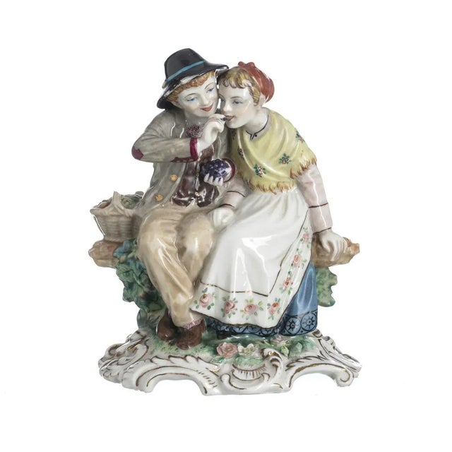 European porcelain sculpture, polychrome and gilded decoration with flowers, plant elements. Flaw. Dimensions: 17 x 14 cm.