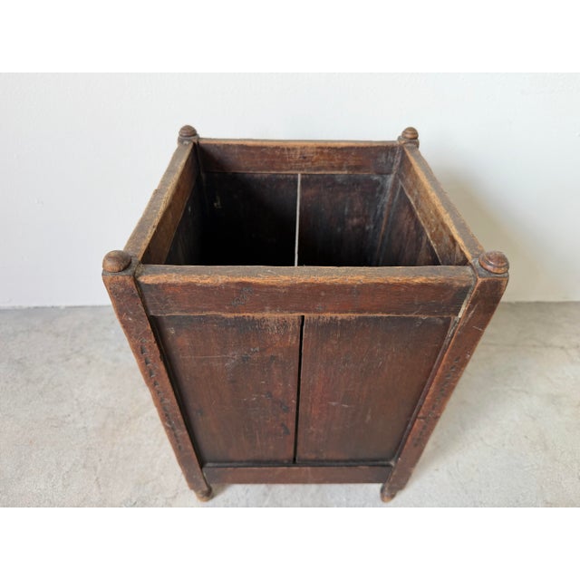 This charming antique French Country wooden wastebasket features a distinctive square tapered silhouette crafted from...