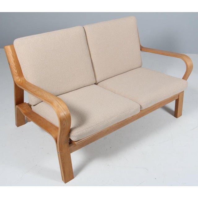 Hans J. Wegner two seat sofa made bended oak veener. Cotton cord in back New upholstered with Coda 2 fabric for kvadrat...